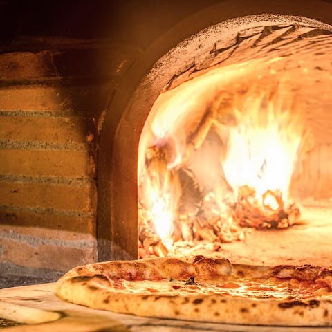 Rustle up Pizza Napolitana in the traditional wood-fire oven