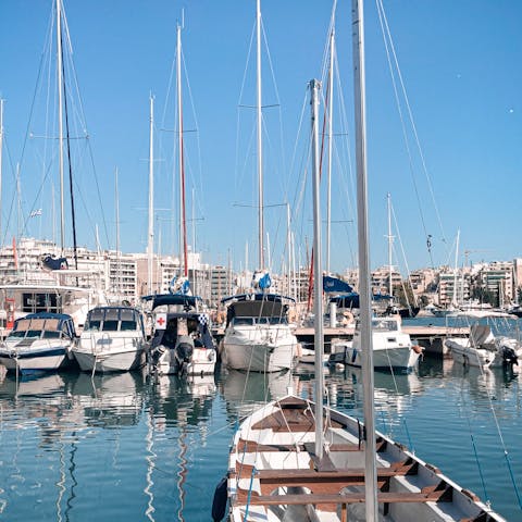 Stroll around Piraeus' vibrant marina, right outside your door