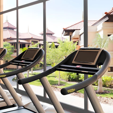 Hit the gym for a morning workout session overlooking the gardens