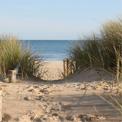 Stroll nine minutes to sandy shore such as The Denes Beach