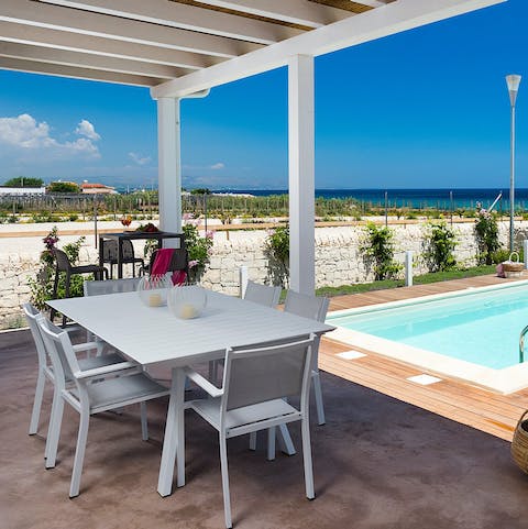 Gather under the pergola for a leisurely Italian lunch