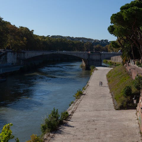 Stroll along the Tiber River, just a three-minute walk away