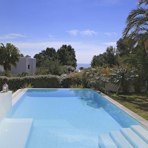 Cool off in the home's private pool with views out to the Baleariac Sea
