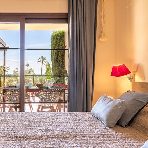 Wake up to swaying palm trees from the main bedroom