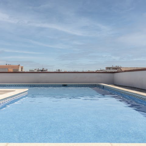 Go for a refreshing dip in the communal rooftop swimming pool