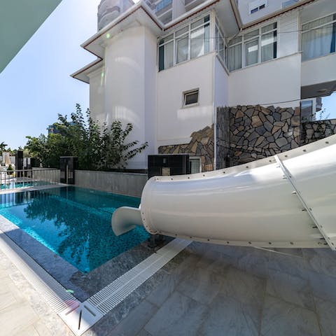 Take the plunge and head down the slide into the pool