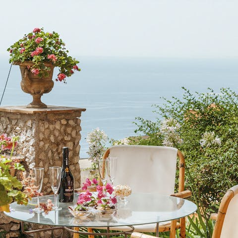 Relax on the terrace with a bottle of wine, savouring the views of the Ionian Sea