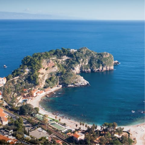 Sprawl out on Spiaggia di Isola Bella, a pebble beach overlooking the famous island