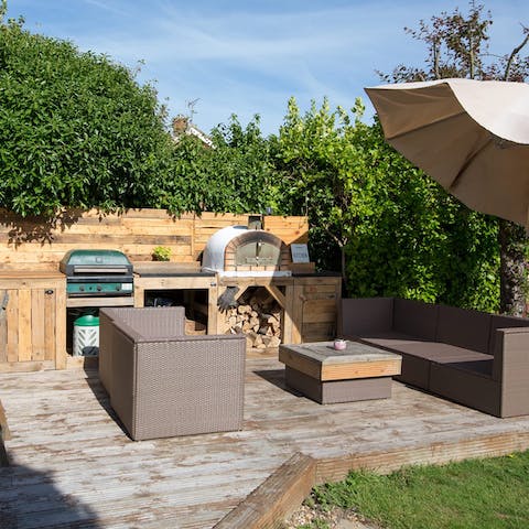 Get together for delicious pizza nights courtesy of the outdoor pizza oven