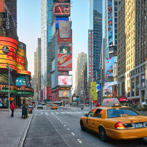 Be dazzled by the bright lights of Times Square, a thirty-minute walk or ten-minute car ride away
