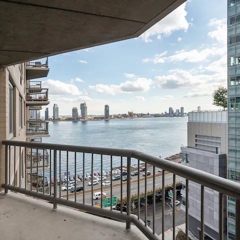 Watch the sun rise over the East River from your private balcony