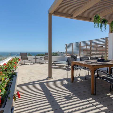 Relax on the roof terrace and enjoy unparalleled views down to the ocean
