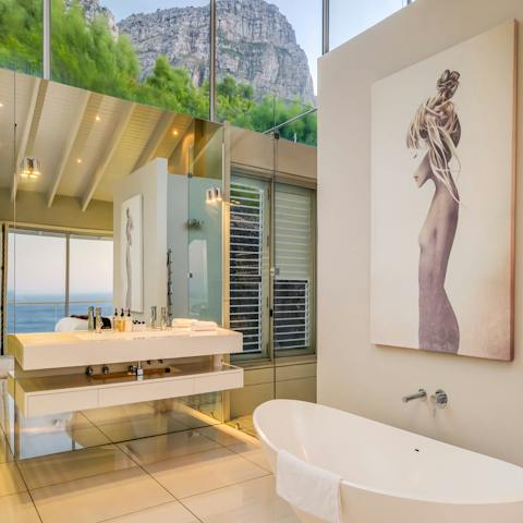 Run a bubble bath and soak up the view of the mountains and the sea