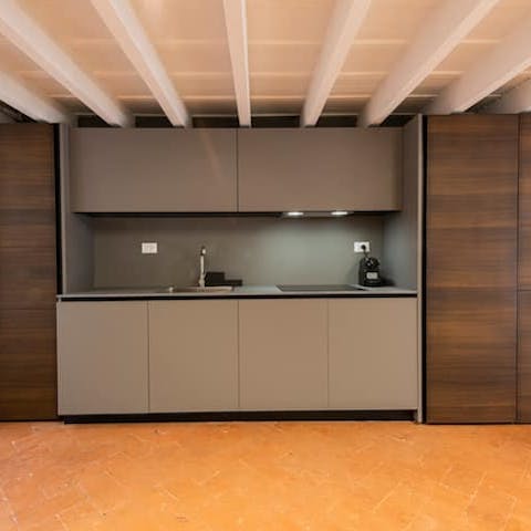 Enjoy the juxtaposition between the sleek modern kitchen and old-world decor