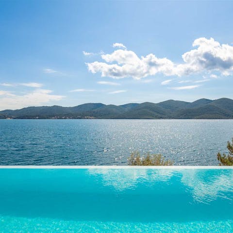 Admire the stunning views of the Adriatic Sea from the infinity pool