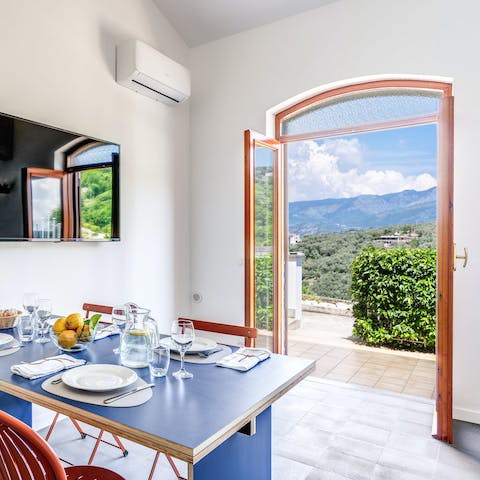Take in the views of the hillside from the dining table