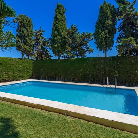 Plunge into your sparkling pool, surrounded by luscious greenery