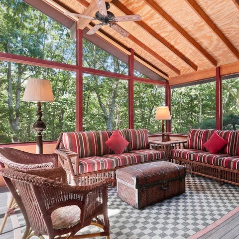 Cosy up with a book on the screened in porch