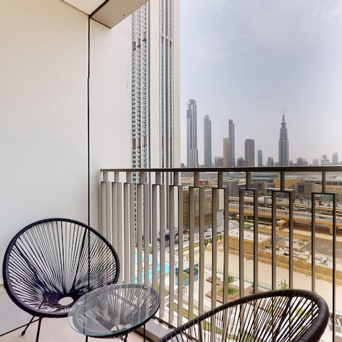 Take in the views over the city skyline from the balcony