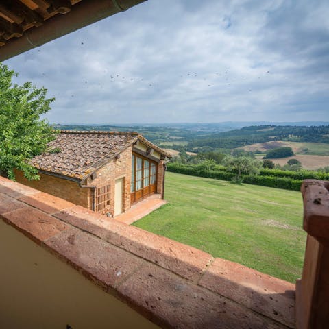 Enjoy stunning views of the Tuscan countryside from this rustic home