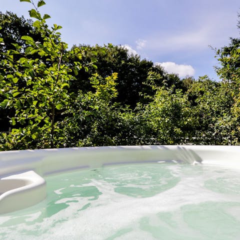 Bubble the night away in the private hot tub, admiring the views as the stars come out