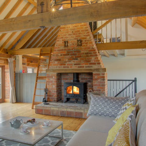 Curl up by the wood-burning fireplace in the living room