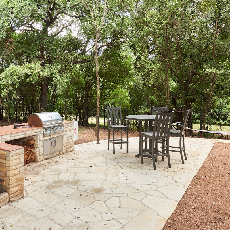 Enjoy an alfresco barbecue feast beneath the shade of the trees in the communal courtyard