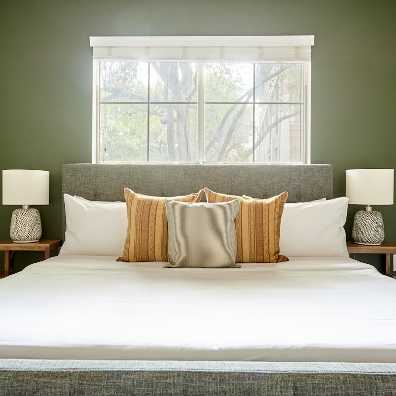 Wake up in your calm green bedroom feeling rested and ready for another day of exploring