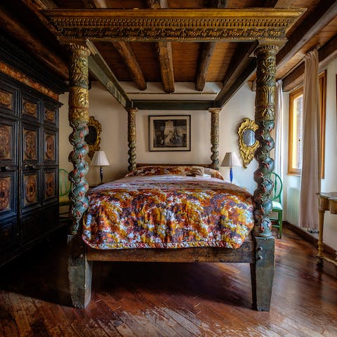 Stretch out in your magnificent 16th century four poster bed