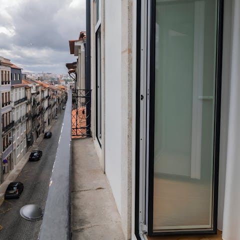 Take in the views over the street from the balcony