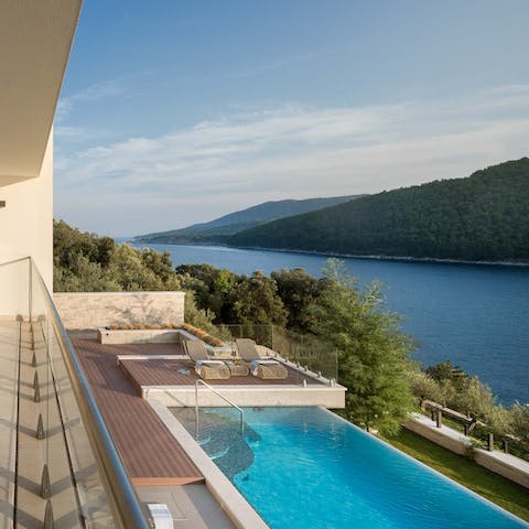 Glide gracefully through the infinity pool or dive into the Adriatic from the nearby pontoon