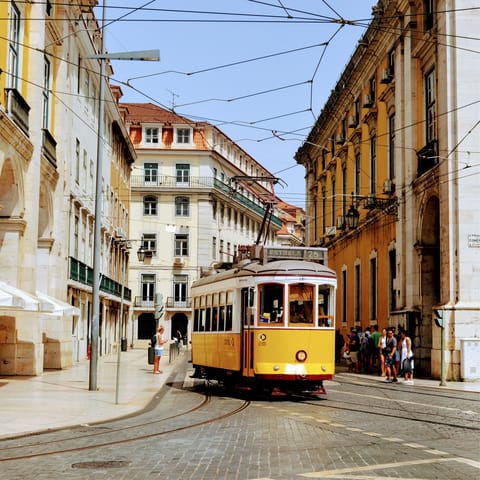 Blaze a trail through the city on Lisbon's iconic trams –⁠ there's a stop less than five minutes away on foot