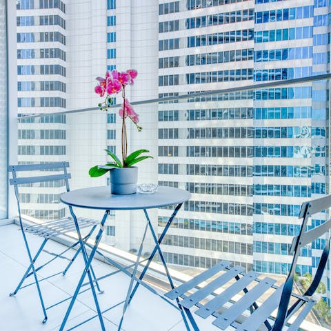 Enjoy your morning coffee with towering skyscraper views over downtown Dubai