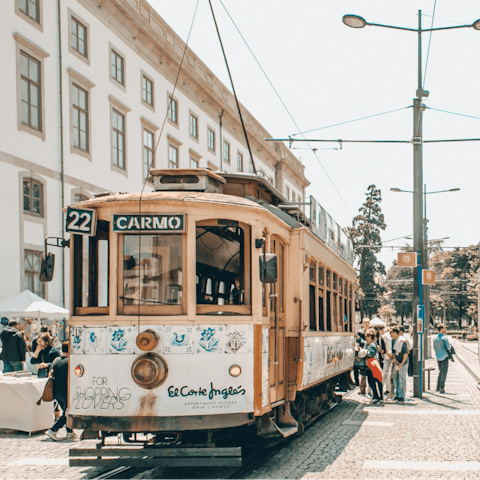 Catch a tram ride across winding streets of Porto