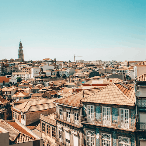 Admire the red roofs of beautiful Porto from a rooftop bar