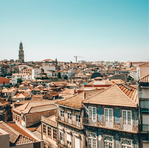 Admire the red roofs of beautiful Porto from a rooftop bar