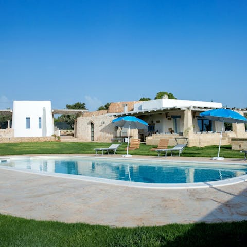 Relax with a refreshing swim in the private outdoor pool