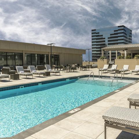 Splash about in the building's rooftop pool and catch some rays on the lounger