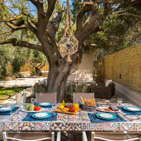 Serve up a Greek feast in the garden dining area with a bottle of local wine