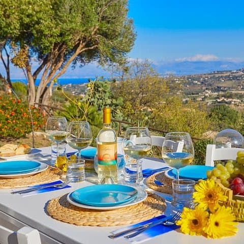Enjoy a meal on the terrace as the Sicilian coast stretches before you