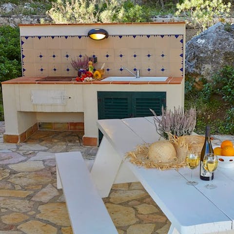 Indulge in a long, lazy lunch outside, thanks to the little summer kitchen