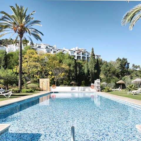 Spend a slow afternoon relaxing by the communal pool