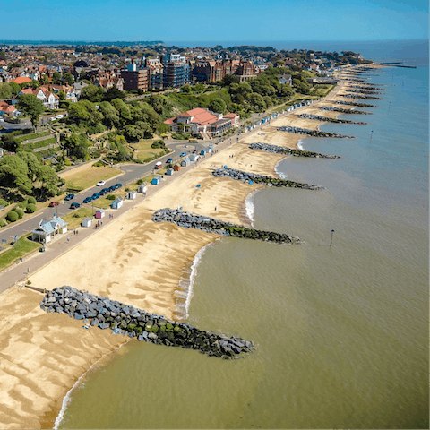 Sink your toes in the sand at Felixstowe Beach, a twenty-minute drive from your door