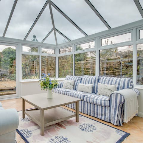 Relax with a good book in the sunny conservatory