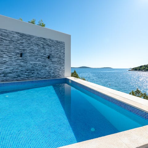 Gaze out at the sparkling Adriatic Sea from your private pool