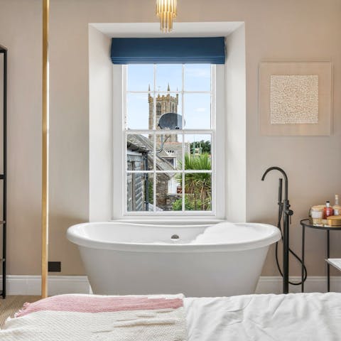 Enjoy the atmospheric views whilst soaking in the luxurious bath
