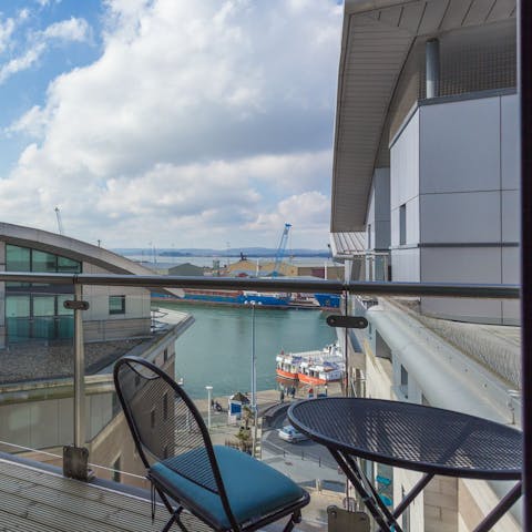 Relax on the balcony with a glass of wine and watch as ships bob in the quay