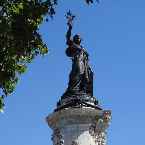 Take a fifteen-minute walk to visit the iconic Place de la République