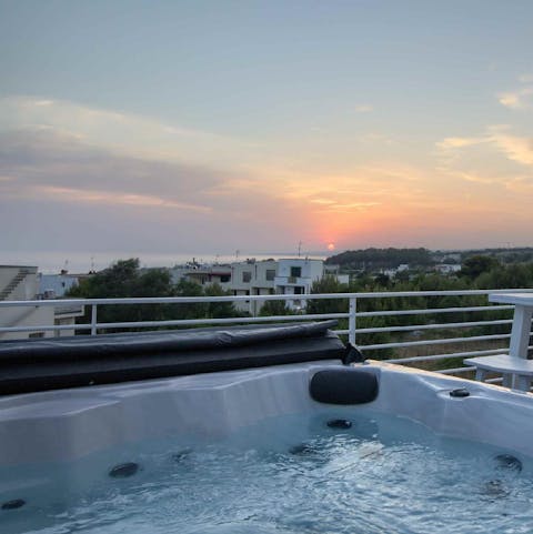 Chill out in the Jacuzzi and admire the sea views