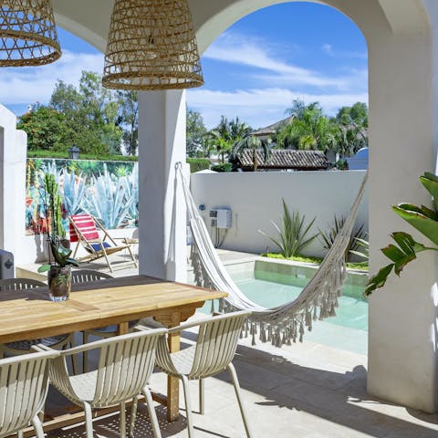 Snooze in the hammock after enjoying an alfresco lunch on the terrace